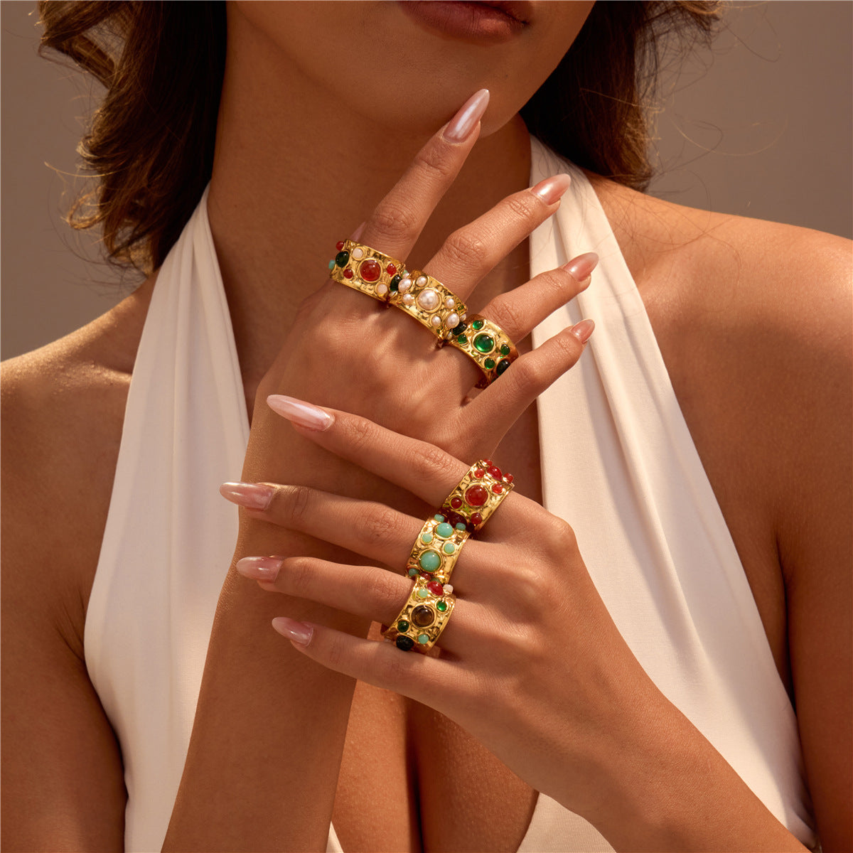 French court-style, multi-gemmed open-front ring