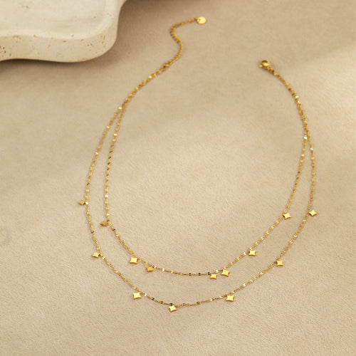 A layered necklace with a dual-layer design element.