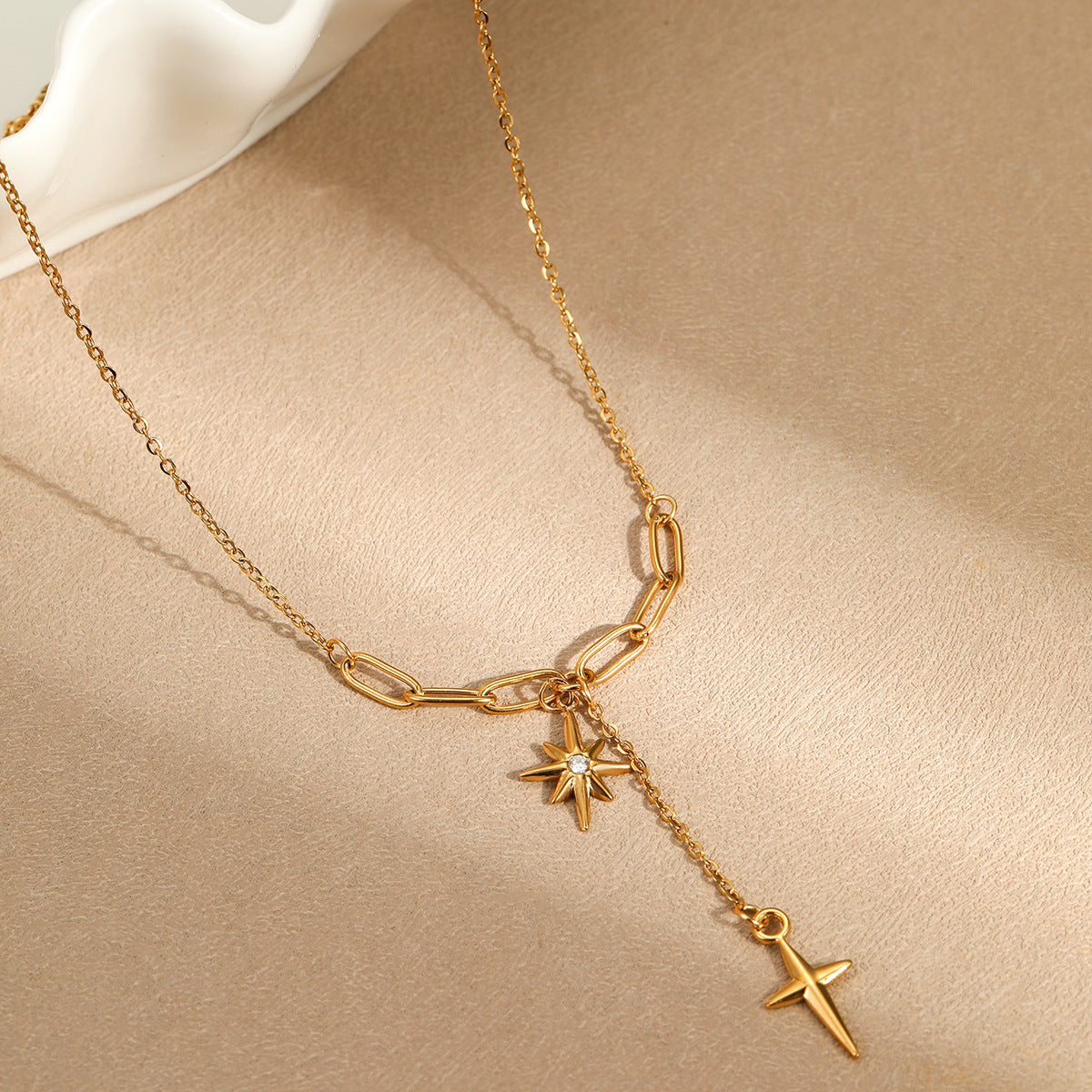 Minimalist lock-style chain with diamond-encrusted eight-pointed star necklace