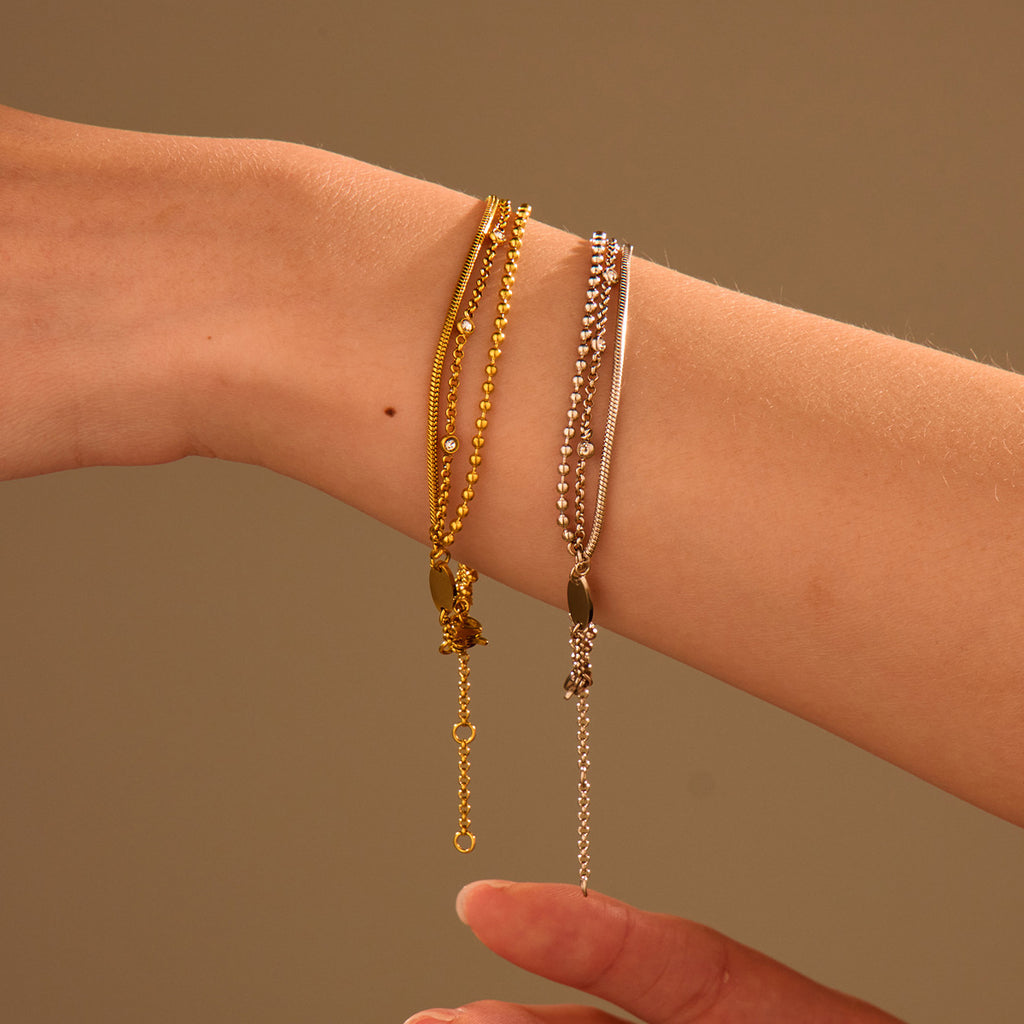 High-end, multi-layered bracelet with embedded zircon stones that can be layered together.