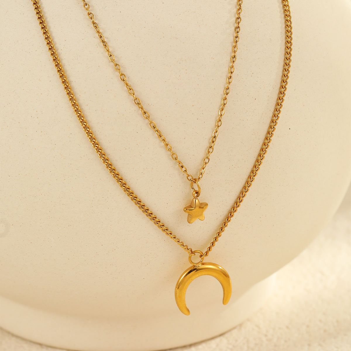 Retro-style necklace, gold-plated with a moon-shaped star motif made of titanium steel