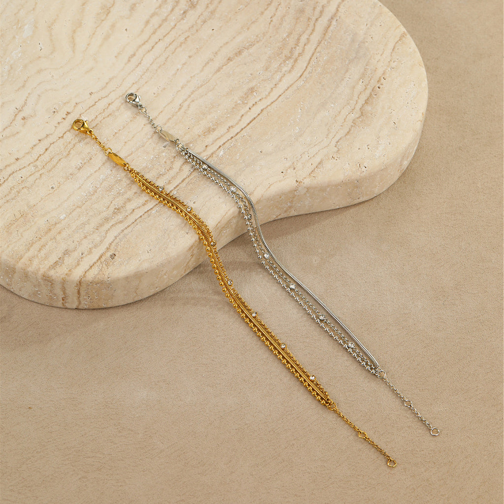 High-end, multi-layered bracelet with embedded zircon stones that can be layered together.