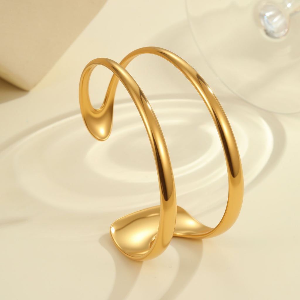 Exaggeratedly designed, 18K gold-plated, open-faced bracelet