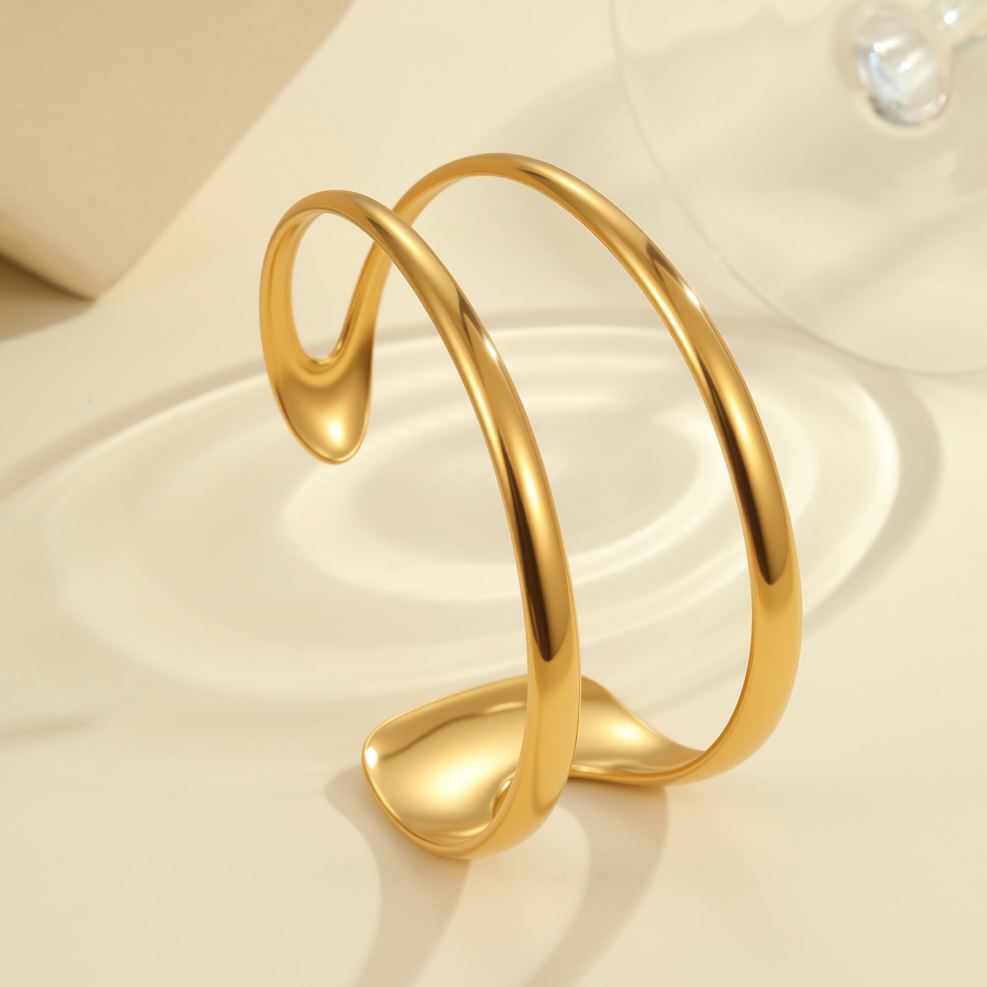 Exaggeratedly designed, 18K gold-plated, open-faced bracelet