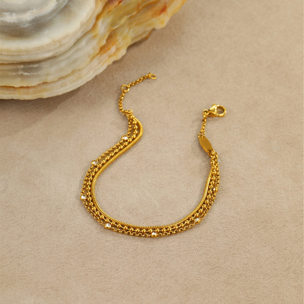 High-end, multi-layered bracelet with embedded zircon stones that can be layered together.