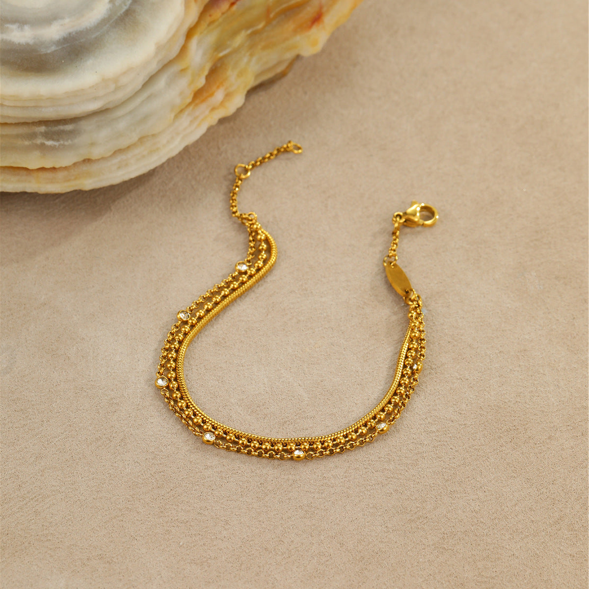 High-end, multi-layered bracelet with embedded zircon stones that can be layered together.