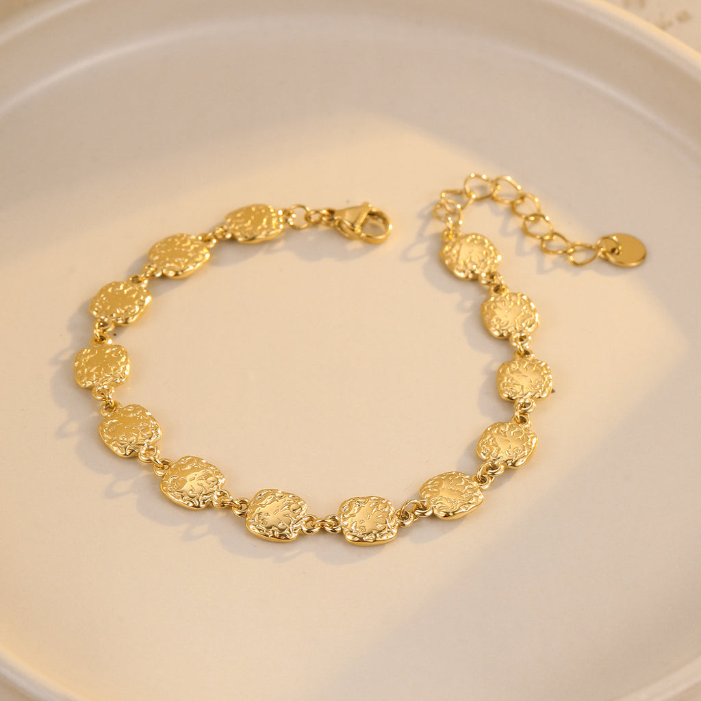 Square-shaped hammered gold bracelet
