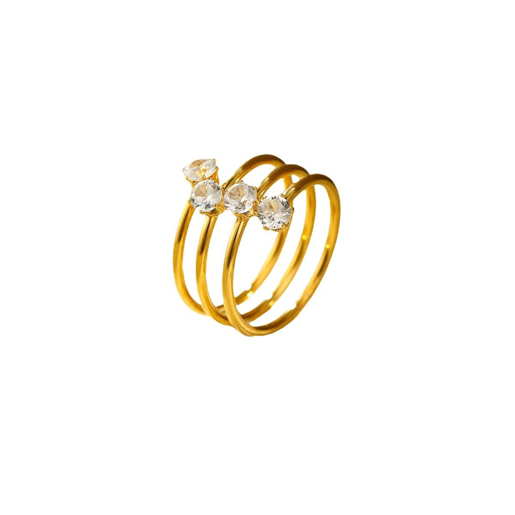 A three-layer ring featuring four zircon stones and an open design