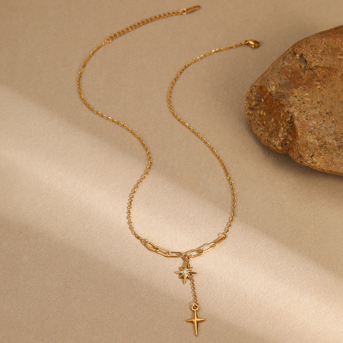Minimalist lock-style chain with diamond-encrusted eight-pointed star necklace